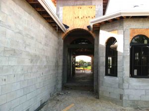 House building - House entrance without stucco - concrete building blocks 